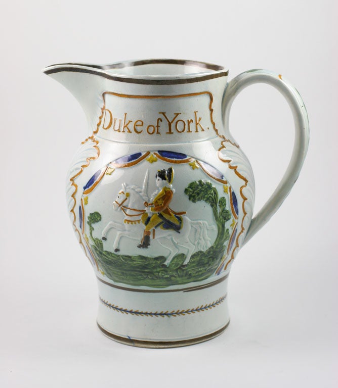 A fine English pearlware pitcher molded with the Duke of York and Prince Cobourg and decorated in underglaze Pratt colors